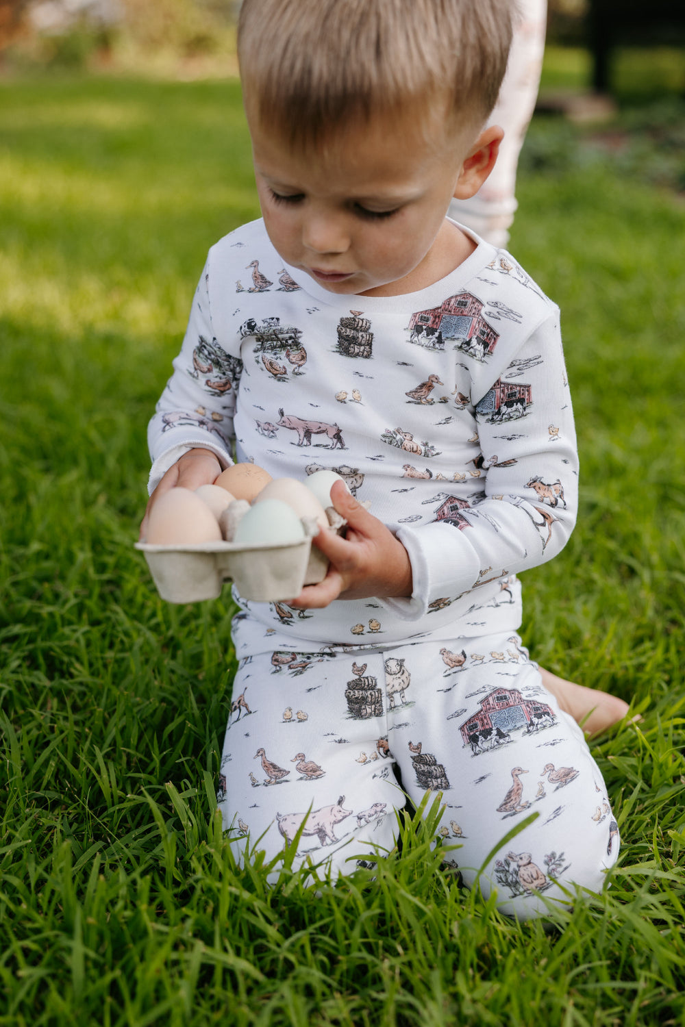 Child wearing Kids' Organic L/Sleeve PJ Set in Farm Friends.