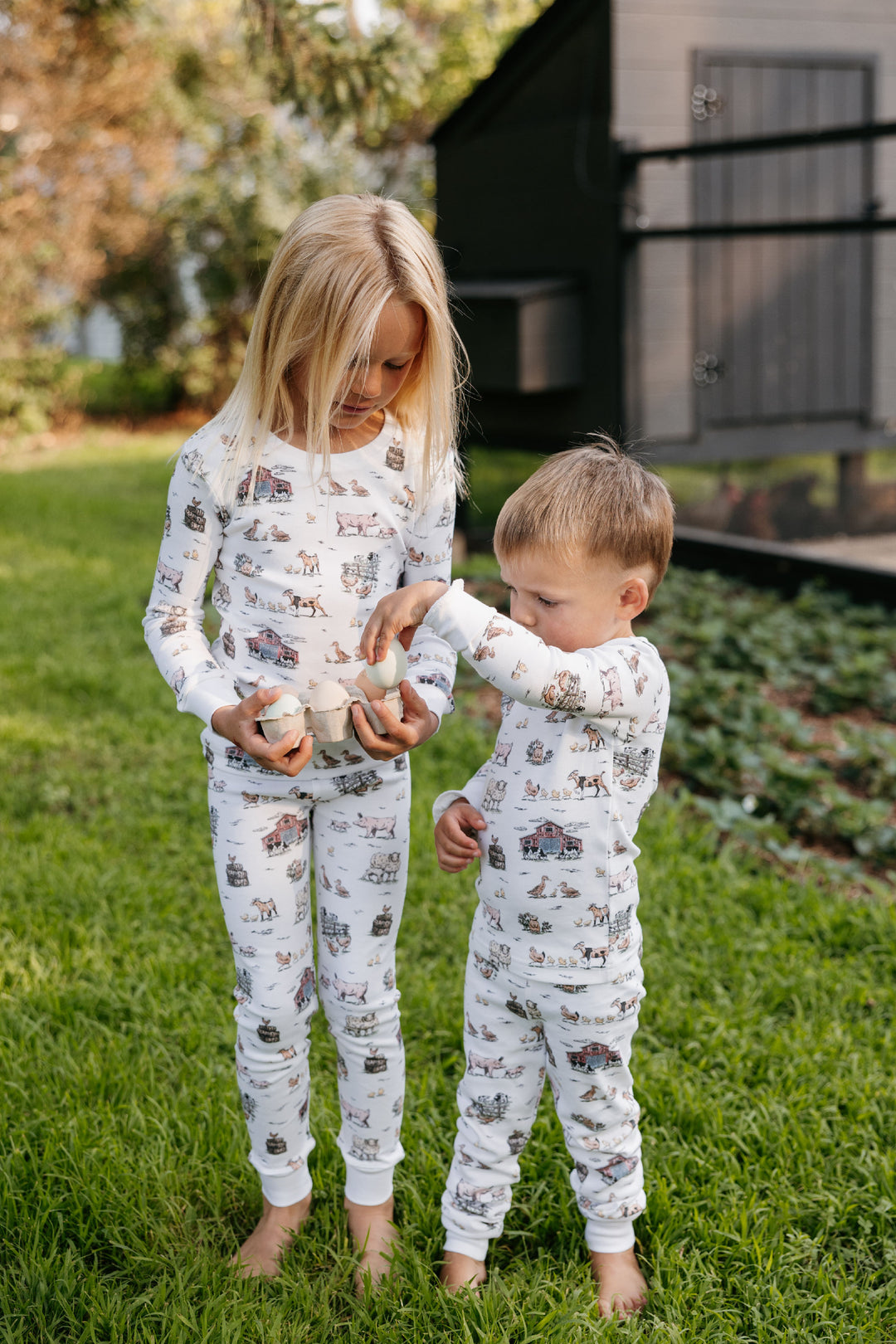 Child wearing Kids' Organic L/Sleeve PJ Set in Farm Friends.