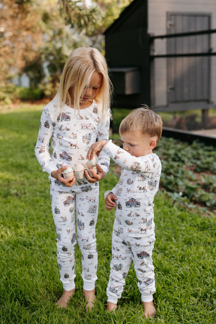 Child wearing Kids' Organic L/Sleeve PJ Set in Farm Friends.