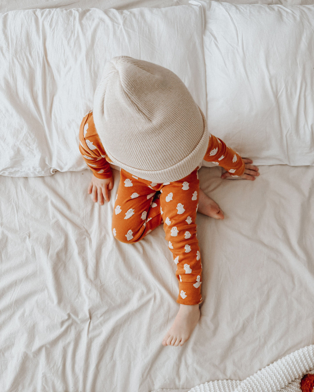 Child wearing Kids' Organic L/Sleeve PJ Set in Ghosts.