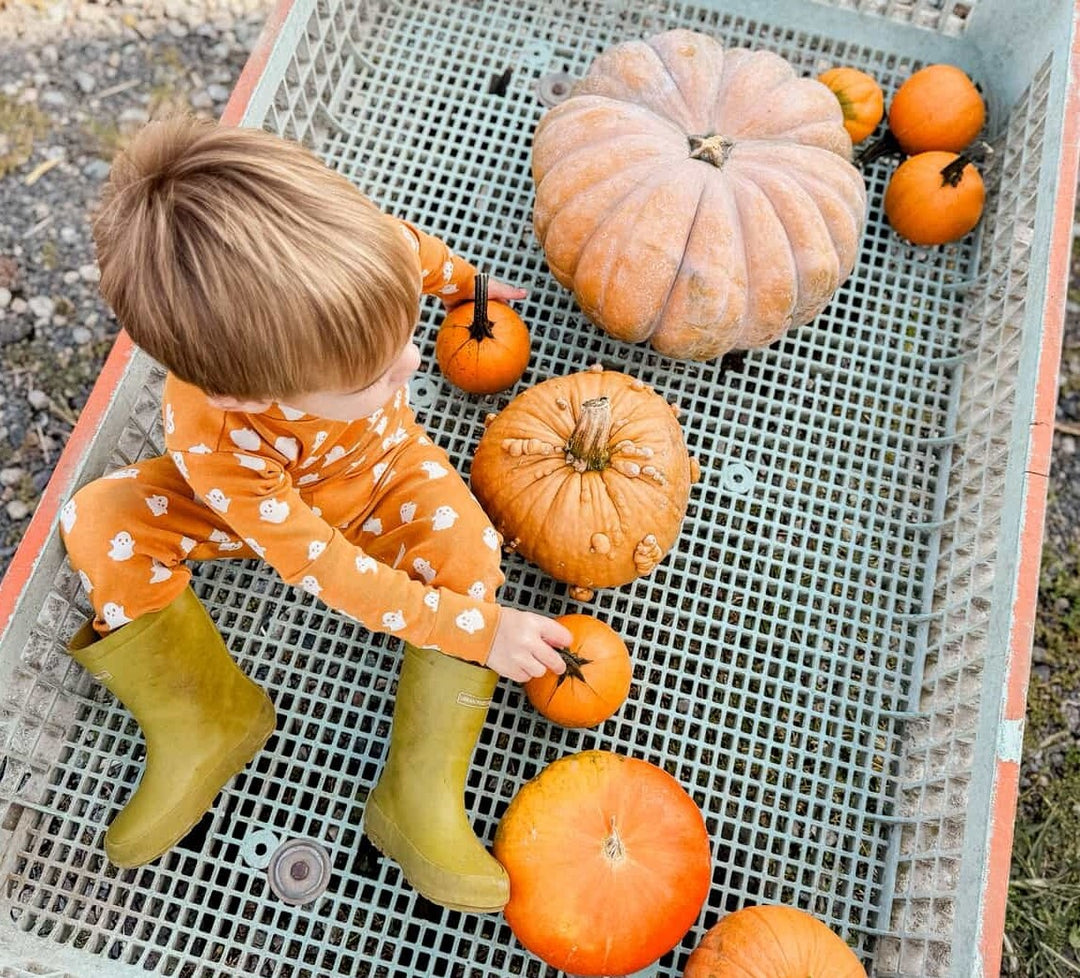 Child wearing Kids' Organic L/Sleeve PJ Set in Ghosts.