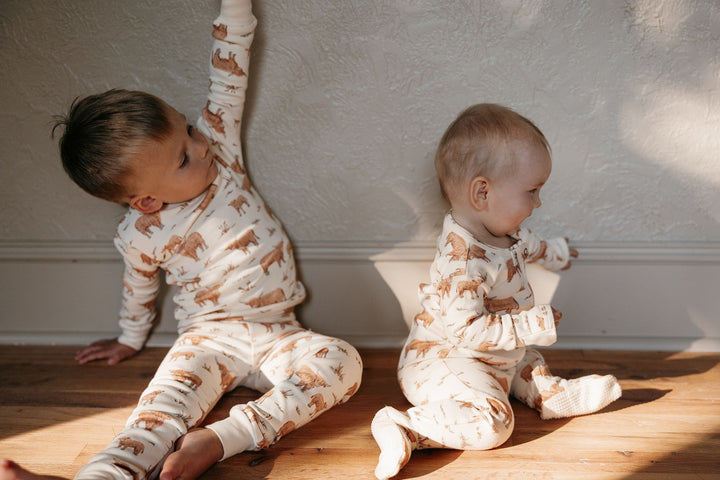 Child wearing Kids' Organic L/Sleeve PJ Set in Highland Cow.