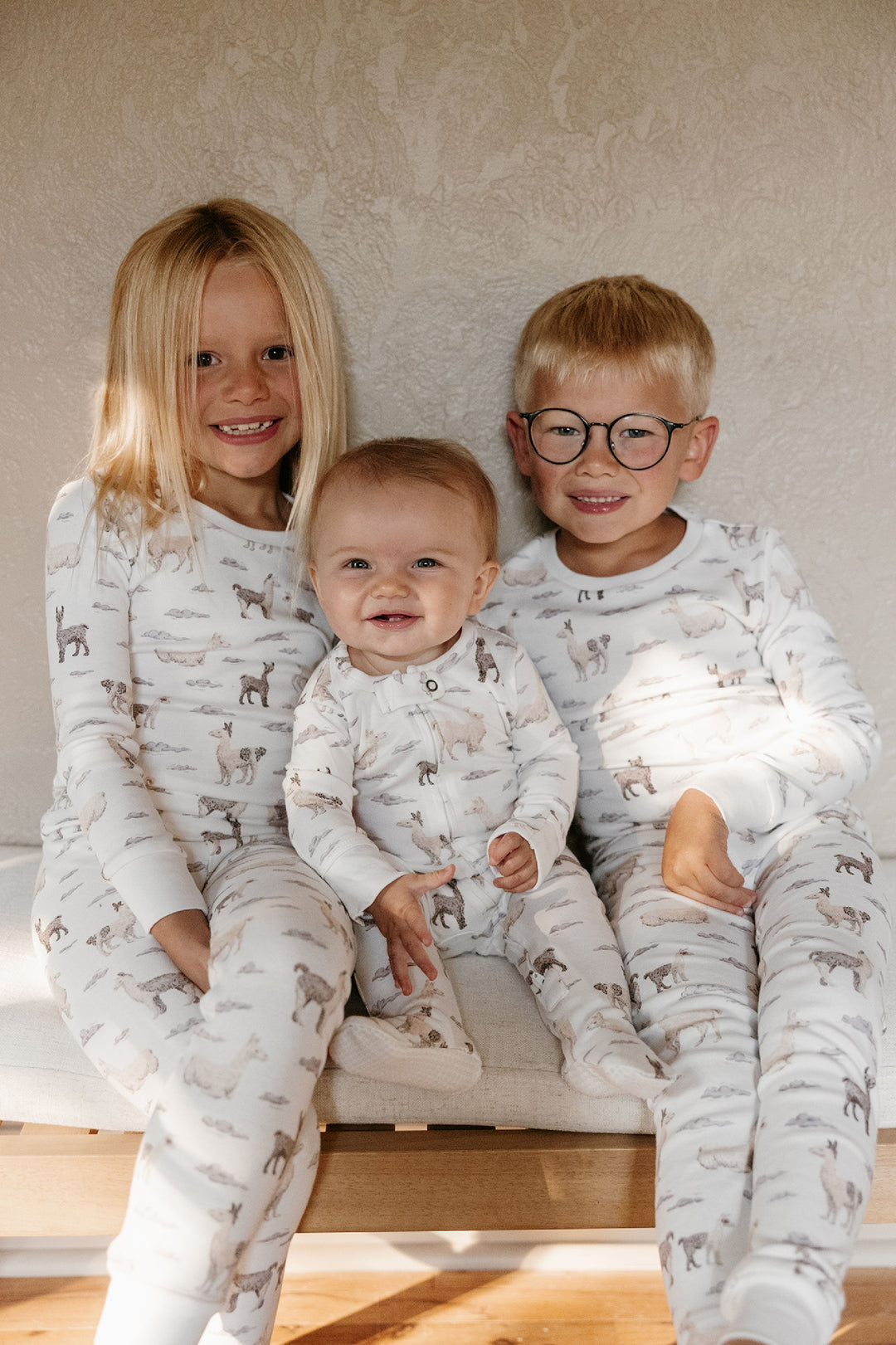 Child wearing Kids' Organic L/Sleeve PJ Set in Llama.