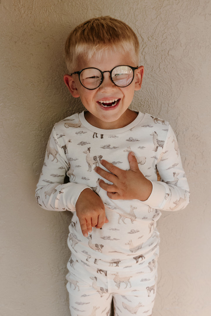 Child wearing Kids' Organic L/Sleeve PJ Set in Llama.