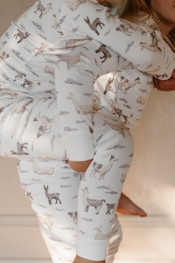 Child wearing Kids' Organic L/Sleeve PJ Set in Llama.