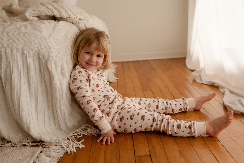 Child wearing Kids' Organic L/Sleeve PJ Set in Tiny Tortoise.