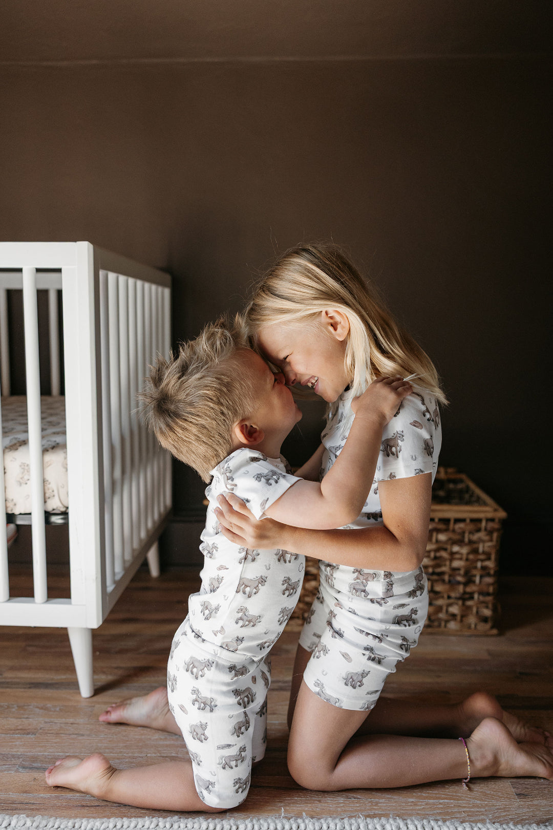 Child wearing Kids' Organic Short-Sleeve PJ Set in Little Lasso.