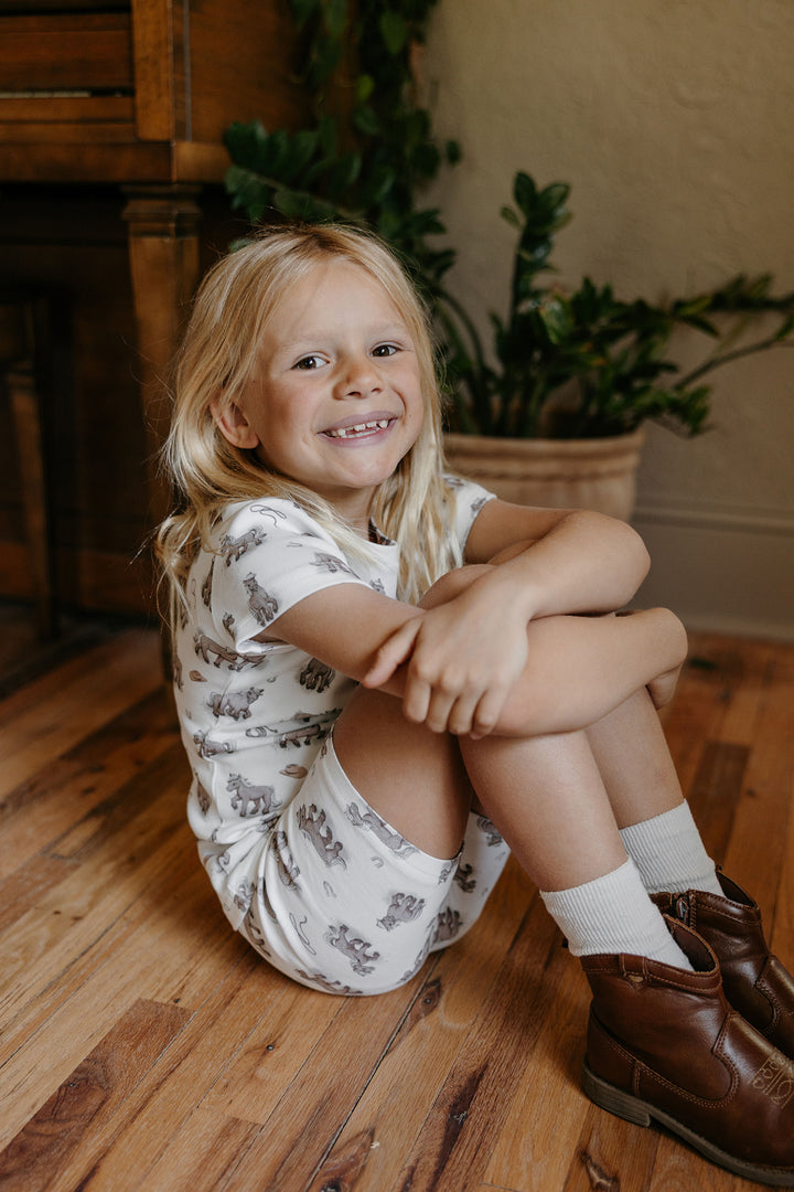 Child wearing Kids' Organic Short-Sleeve PJ Set in Little Lasso.