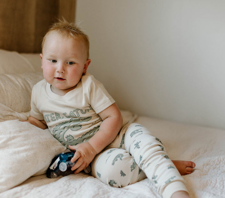 Child wearing Kids' Organic S/Sleeve PJ Set in Alligator.