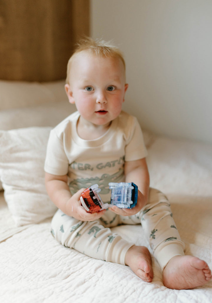Child wearing Kids' Organic S/Sleeve PJ Set in Alligator.