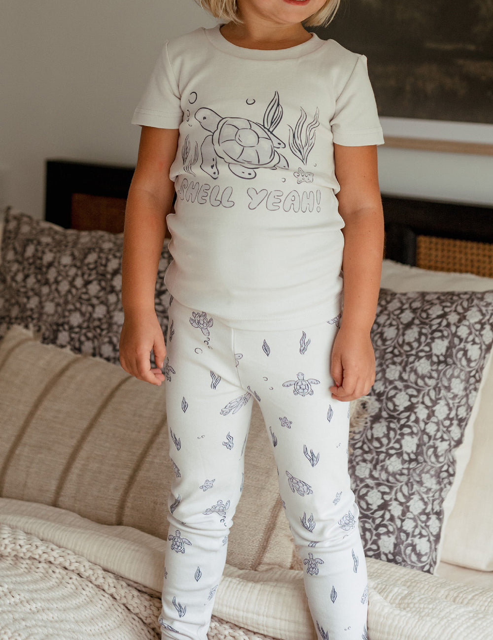 Child wearing Kids' Organic S/Sleeve PJ Set in Sea Turtle.