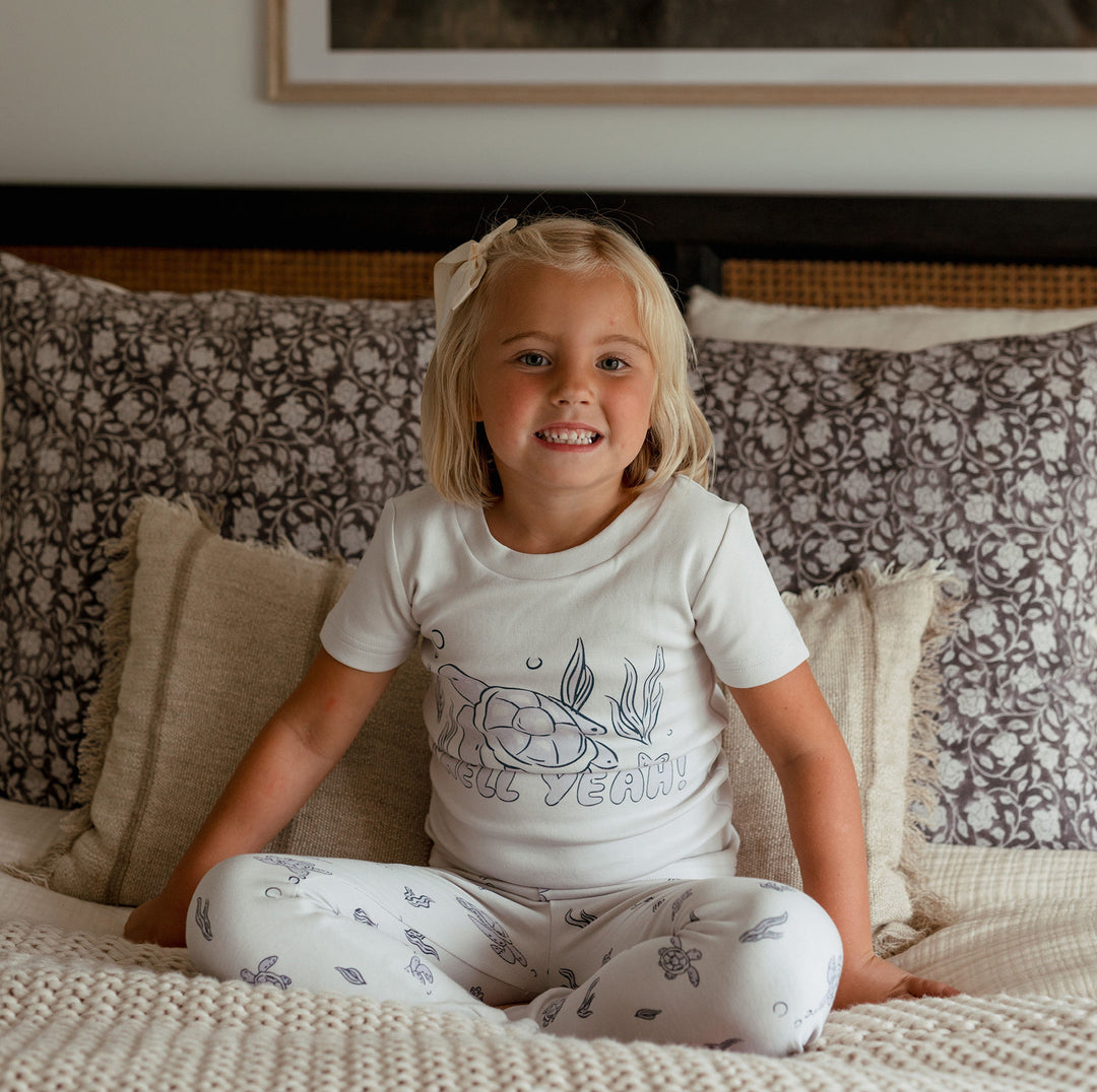 Child wearing Kids' Organic S/Sleeve PJ Set in Sea Turtle.