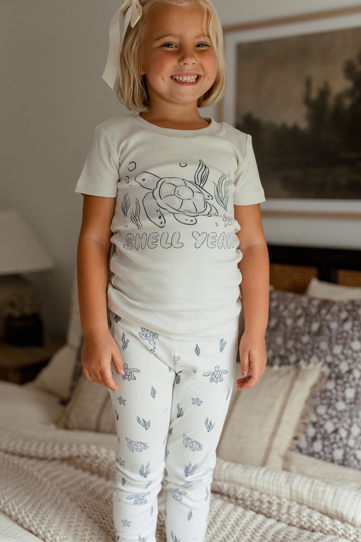 Child wearing Kids' Organic S/Sleeve PJ Set in Sea Turtle.
