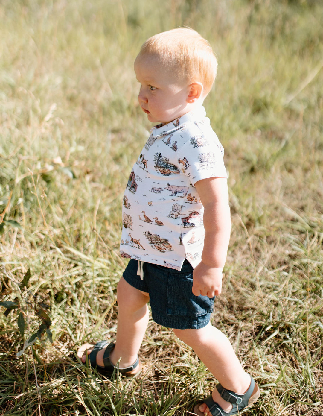Child wearing Kids' Organic Button-Up S/Sleeve in Farm Friends.