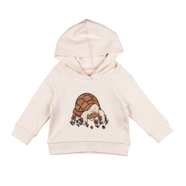 Beige hoodie with a turtle design on a white background