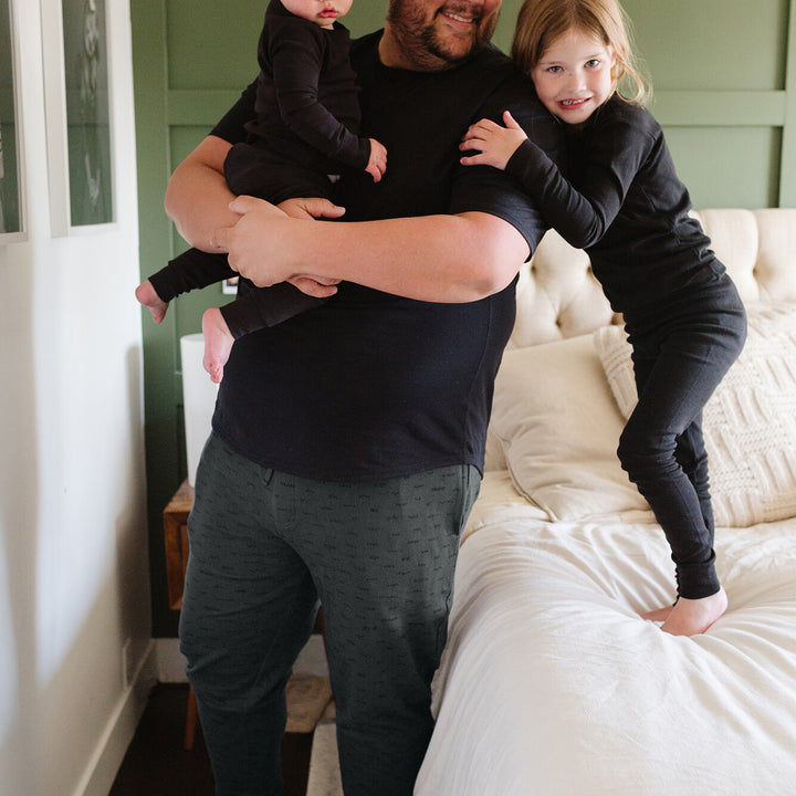 Man with children wearing Men's Organic Dad Joggers in Charcoal.