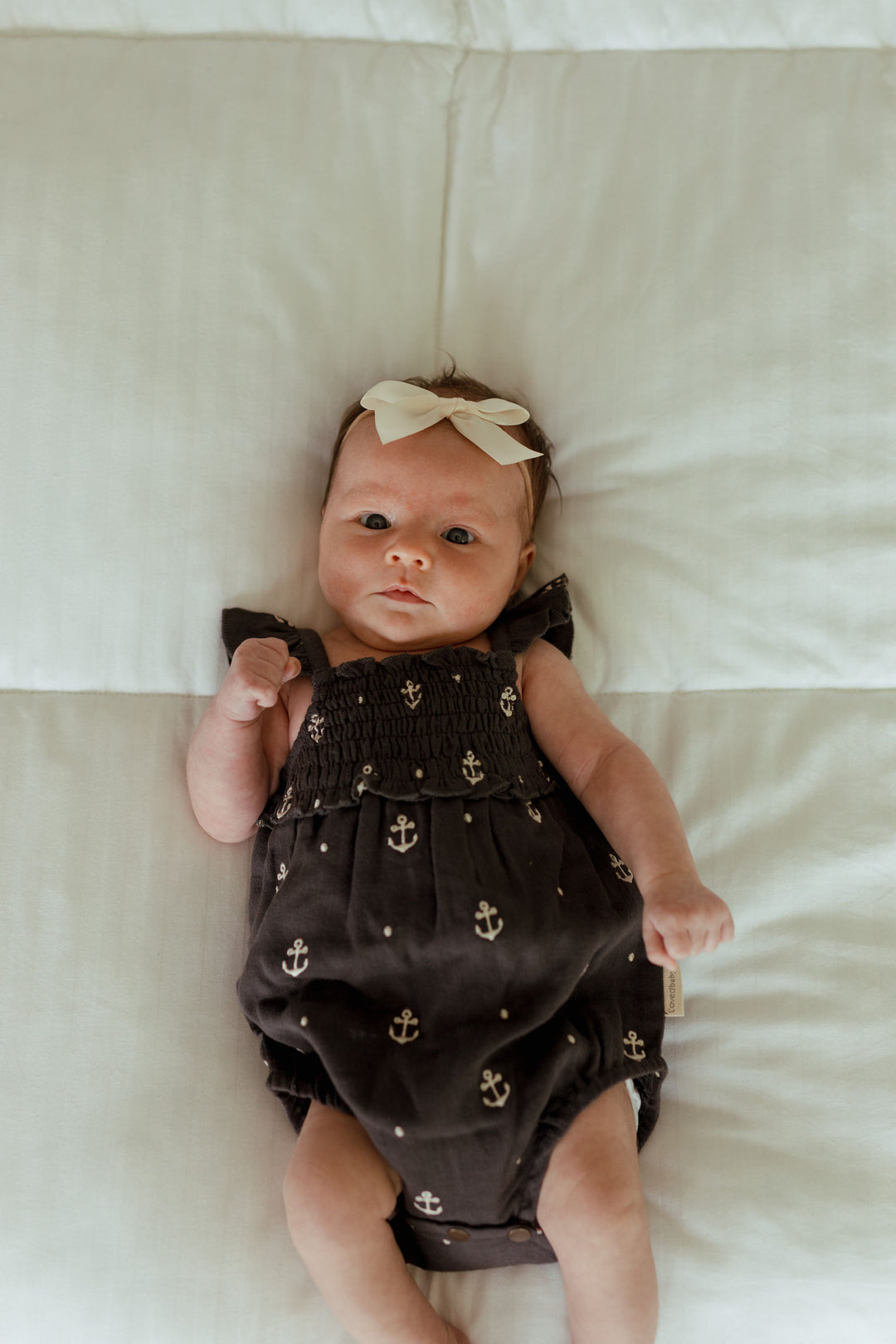 Child wearing Organic Muslin Sleeveless Bodysuit in Chia Anchor.