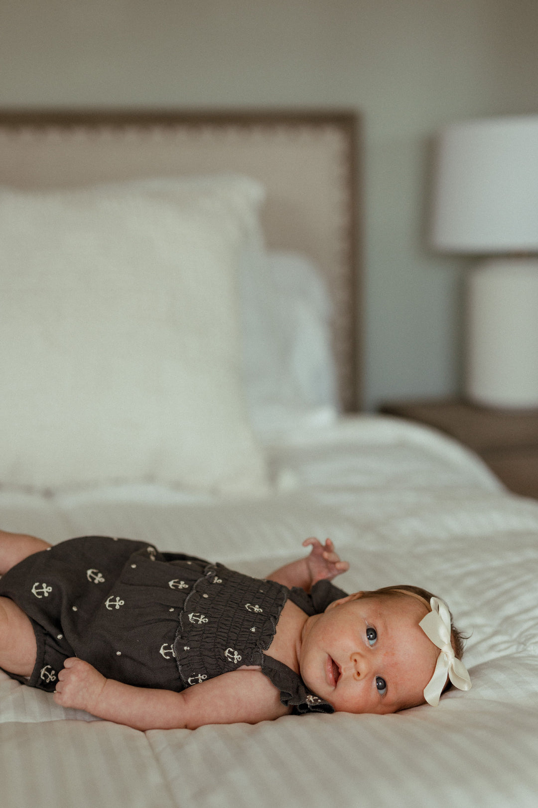 Child wearing Organic Muslin Sleeveless Bodysuit in Chia Anchor.