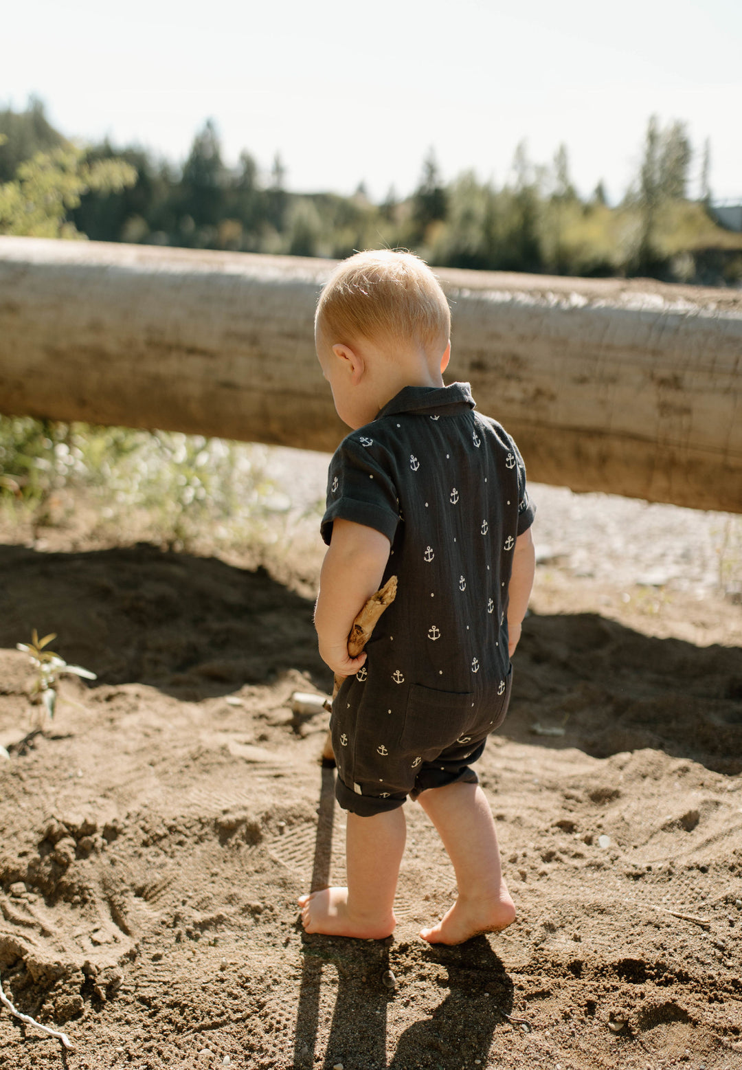 Child wearing Organic Muslin S/Sleeve Coverall in Chia Anchor.