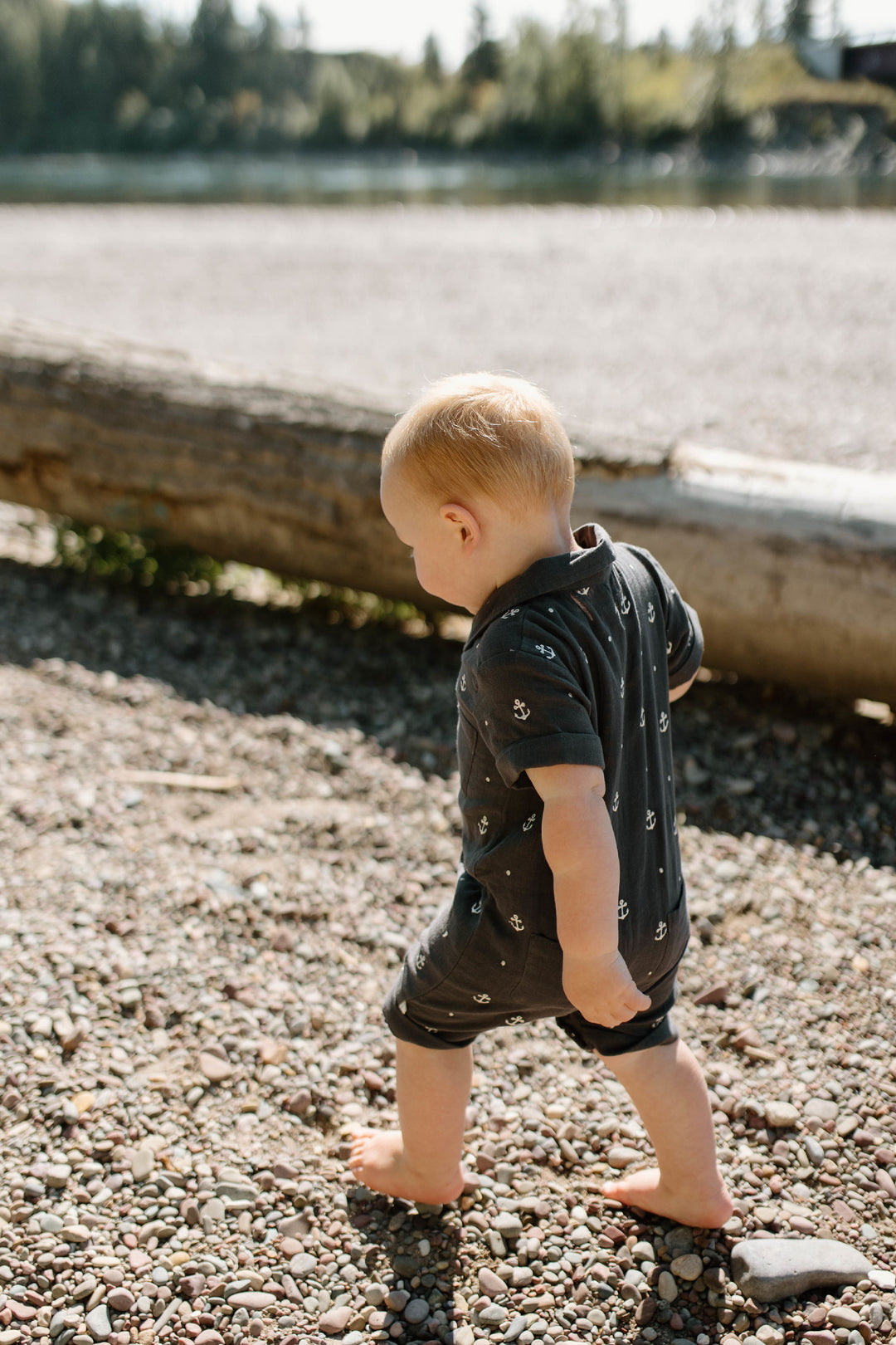 Child wearing Organic Muslin S/Sleeve Coverall in Chia Anchor.
