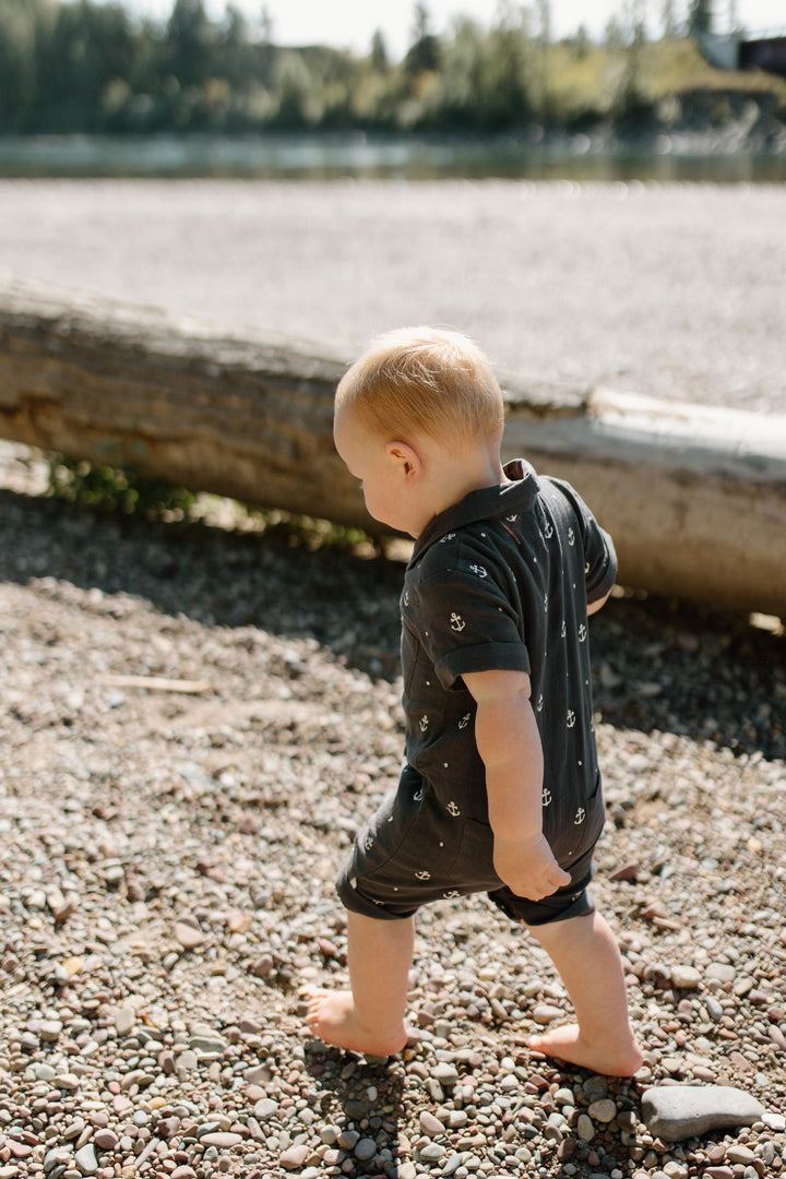 Child wearing Organic Muslin S/Sleeve Coverall in Chia Anchor.