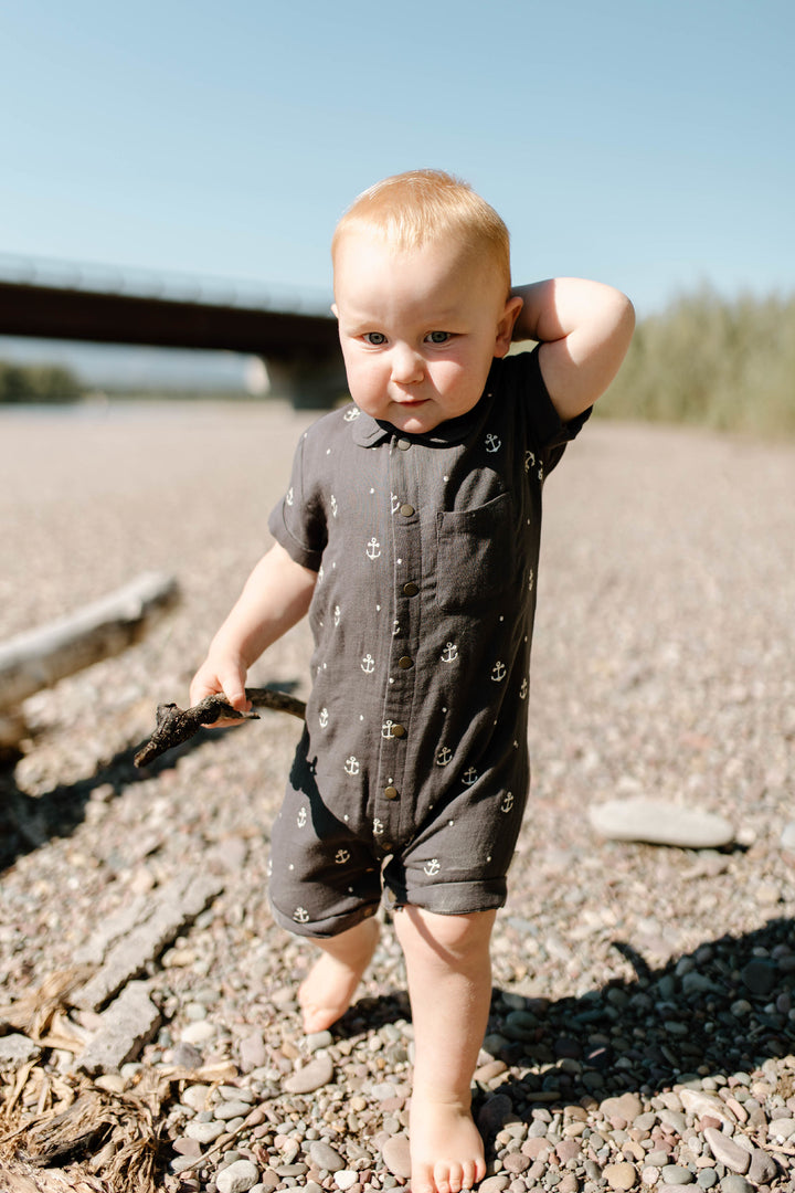 Child wearing Organic Muslin S/Sleeve Coverall in Chia Anchor.
