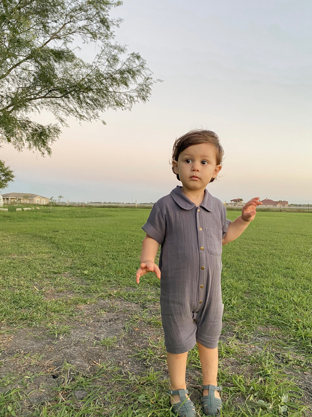 Child wearing a Organic Muslin S/Sleeve Coverall in Dusk