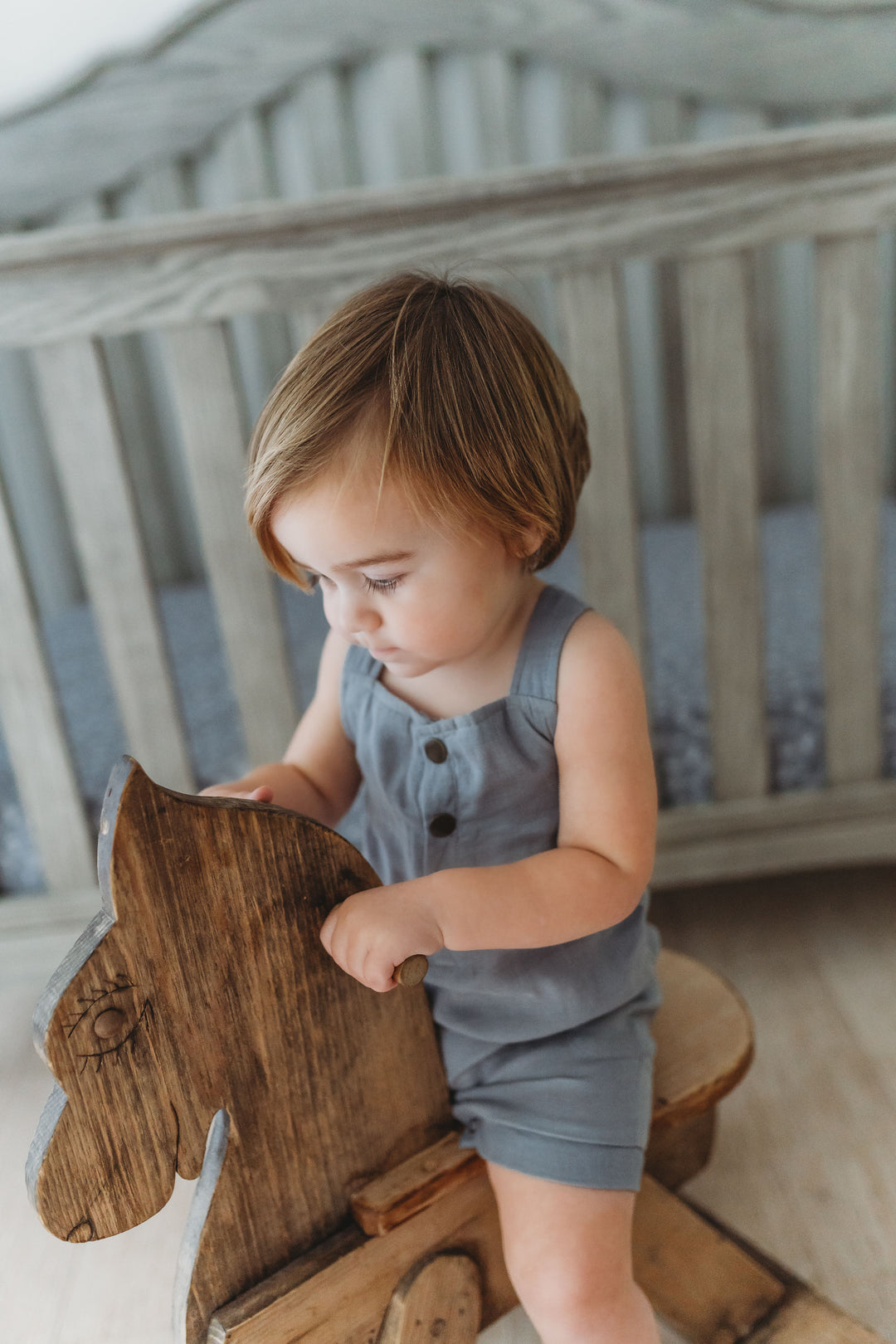 Child wearing Organic Cuffed Muslin Overall in Moonstone.