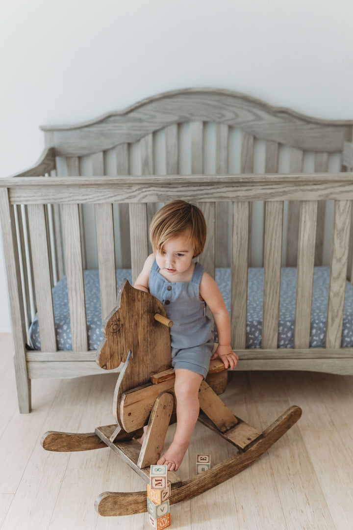 Child wearing Organic Cuffed Muslin Overall in Moonstone.