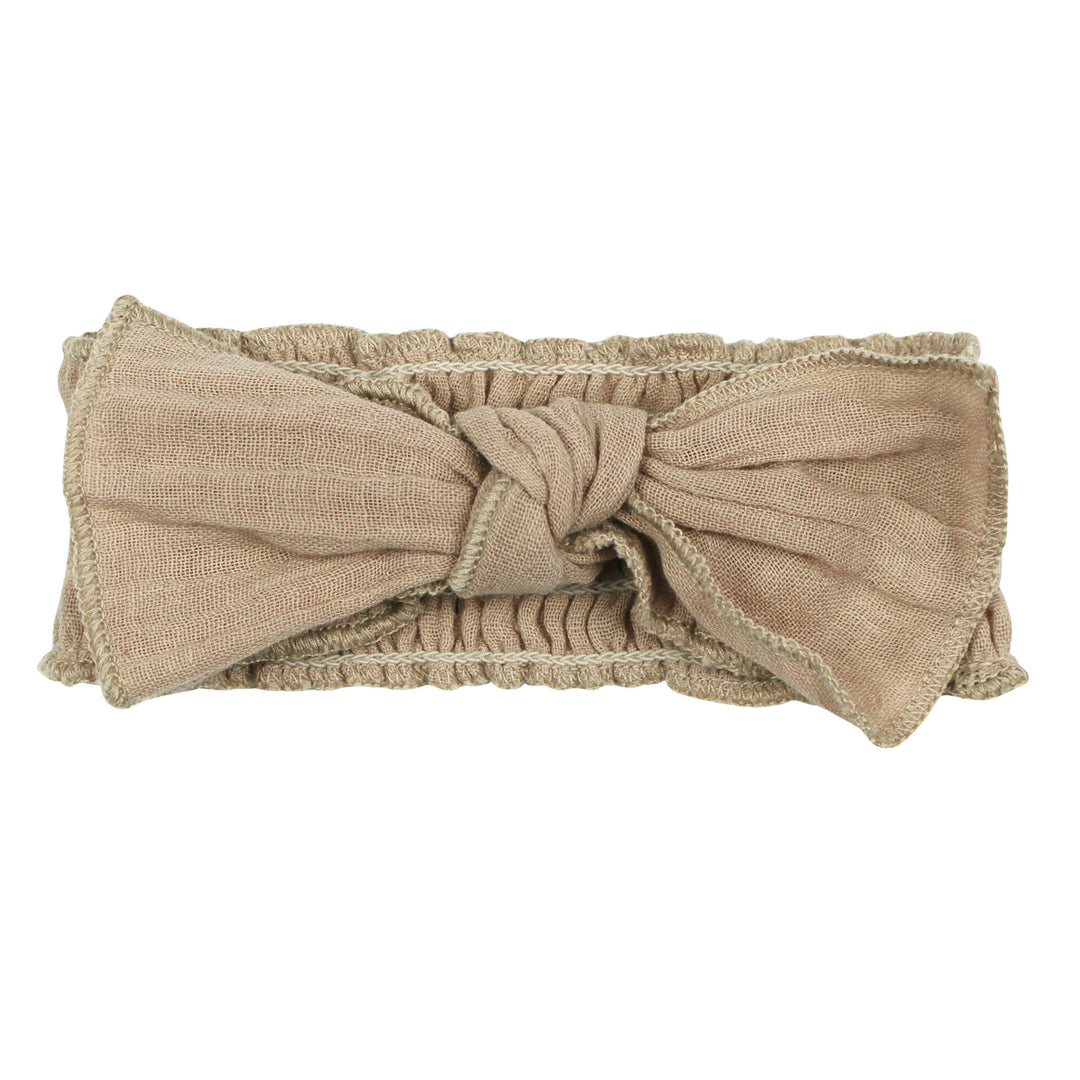 Organic Muslin Smocked Headband in Oatmeal, a light tan color.