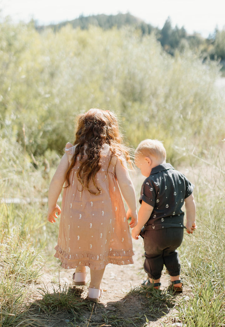 Child wearing Organic Muslin Tee & Harem Pant Set in Chia Anchor.