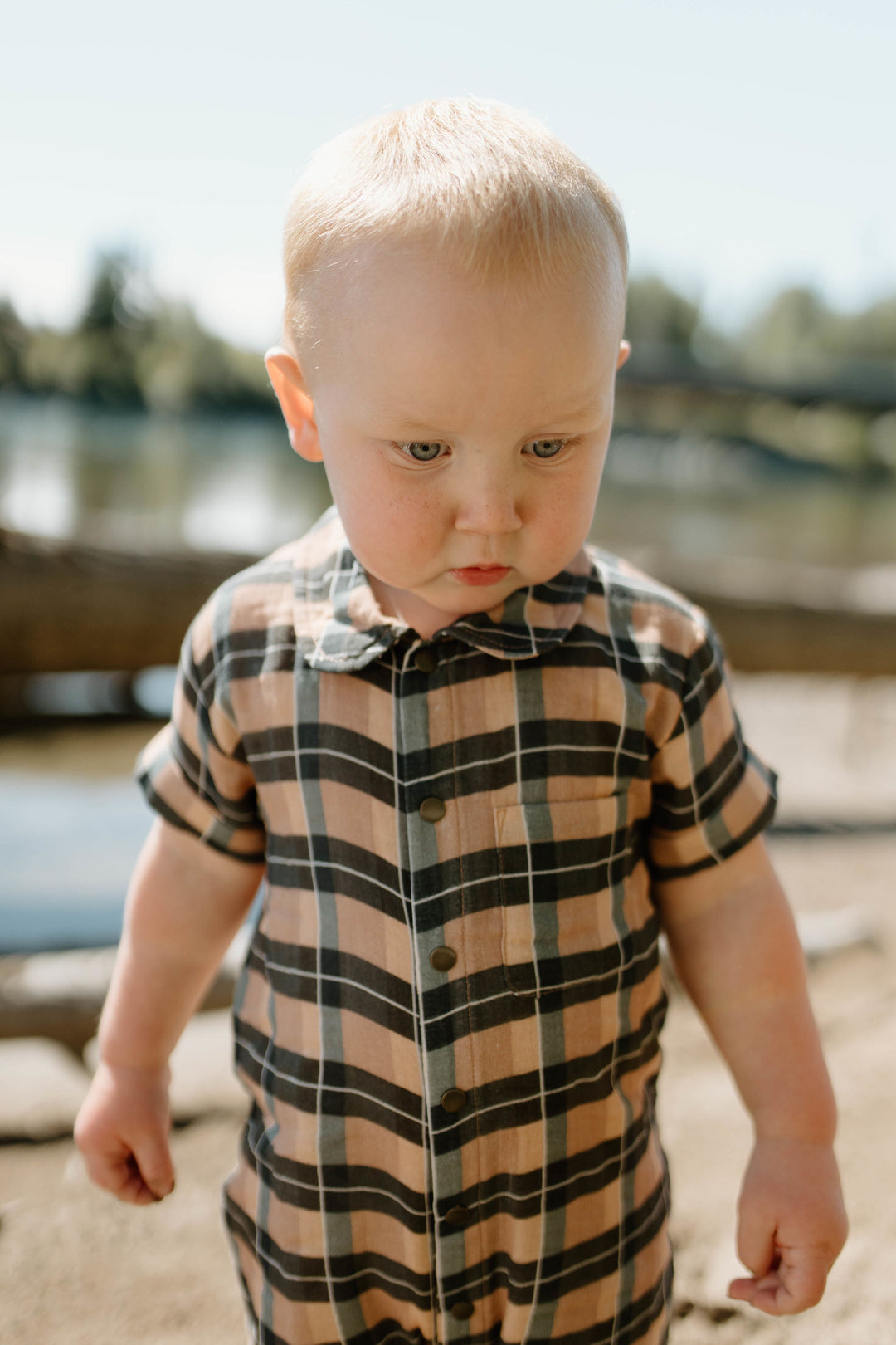 Child wearing Organic Muslin S/Sleeve Coverall in Adobe Chia Plaid.