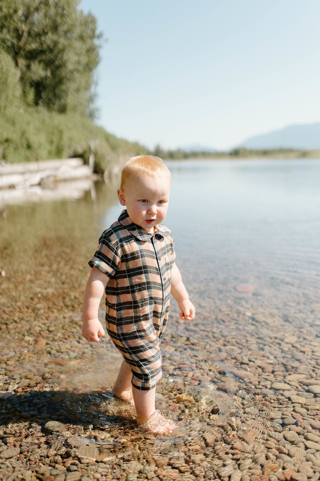 Child wearing Organic Muslin S/Sleeve Coverall in Adobe Chia Plaid.