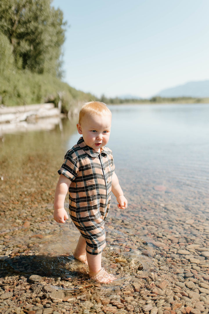 Child wearing Organic Muslin S/Sleeve Coverall in Adobe Chia Plaid.