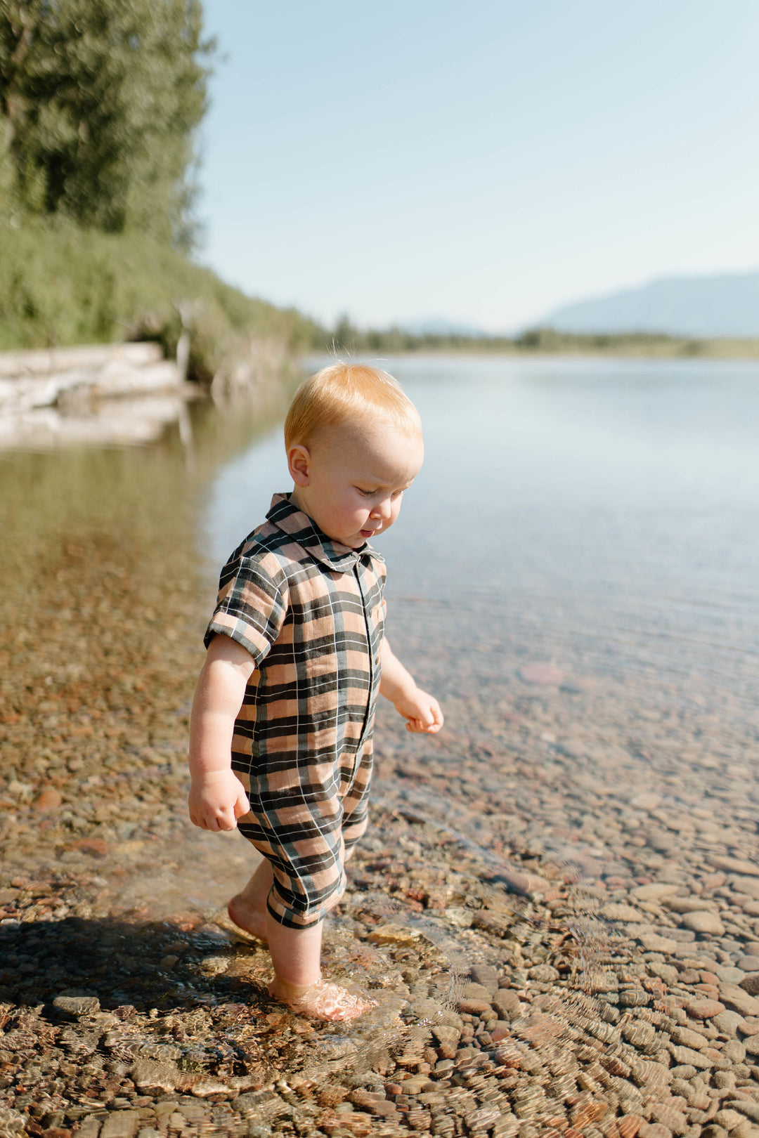 Child wearing Organic Muslin S/Sleeve Coverall in Adobe Chia Plaid.