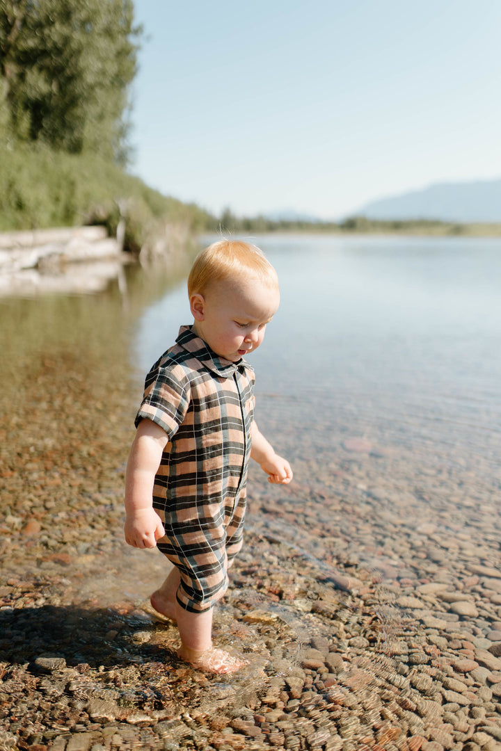 Child wearing Organic Muslin S/Sleeve Coverall in Adobe Chia Plaid.
