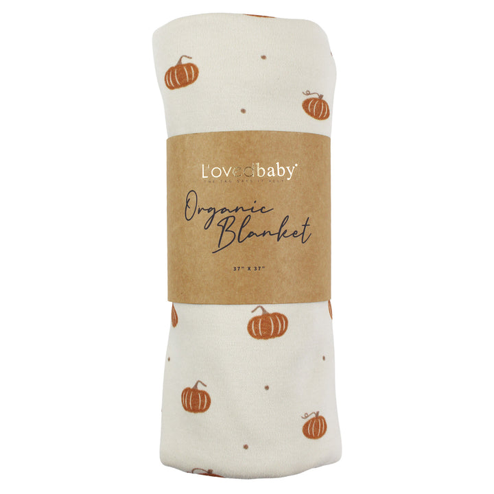 Styled flatlay of Organic Blanket in Pumpkin Spice.
