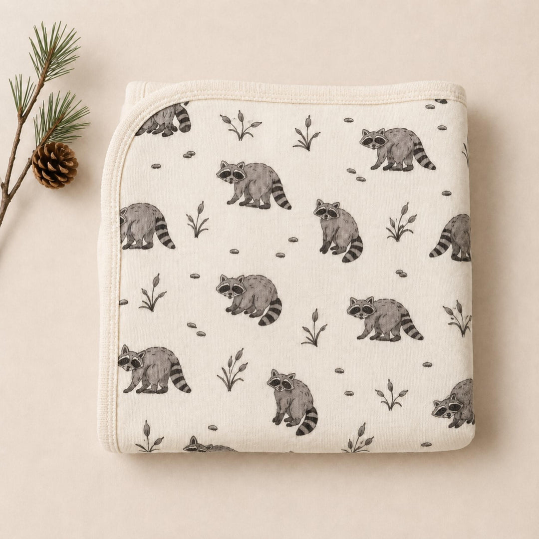 Child wearing Organic Blanket in Raccoon.