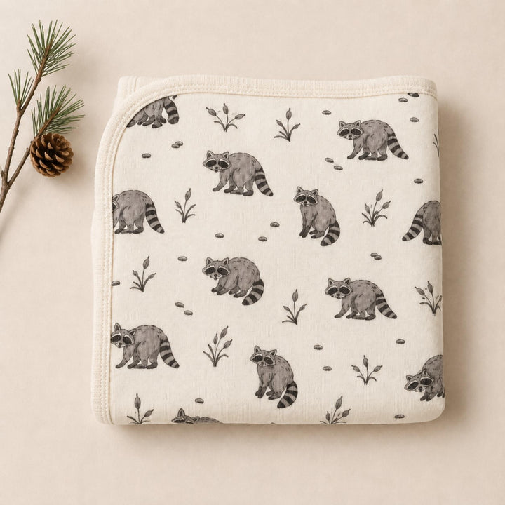 Child wearing Organic Blanket in Raccoon.