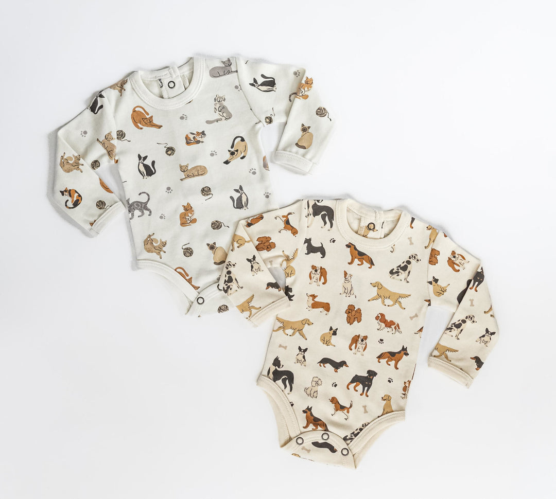 Child wearing Organic Long-Sleeve Bodysuit in Puppy Love.