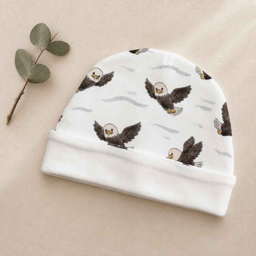 Child wearing Reversible Organic Beanie in Bald Eagle.