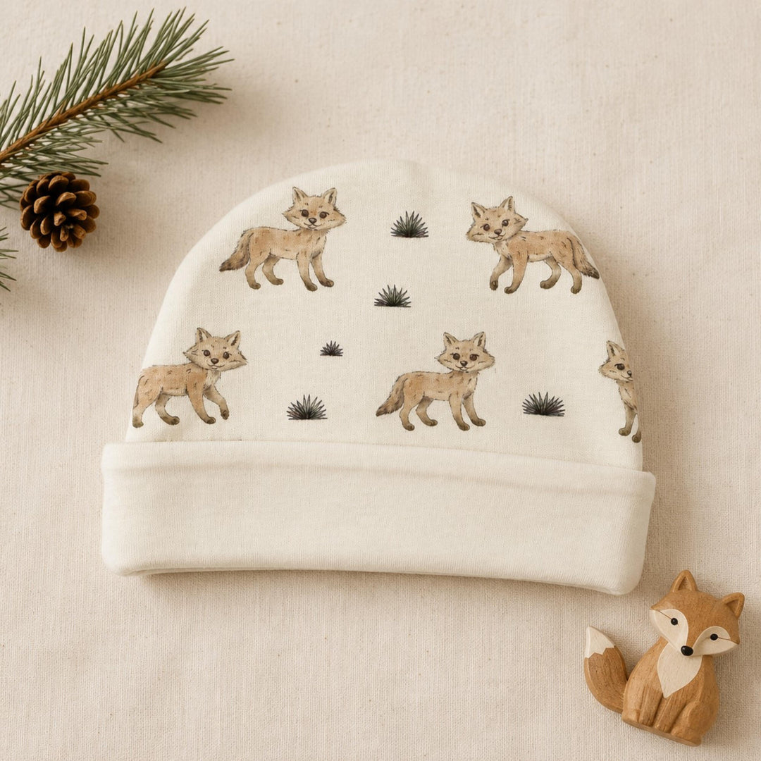 Child wearing Reversible Organic Beanie in Coyote.