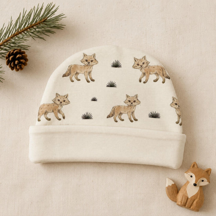 Child wearing Reversible Organic Beanie in Coyote.