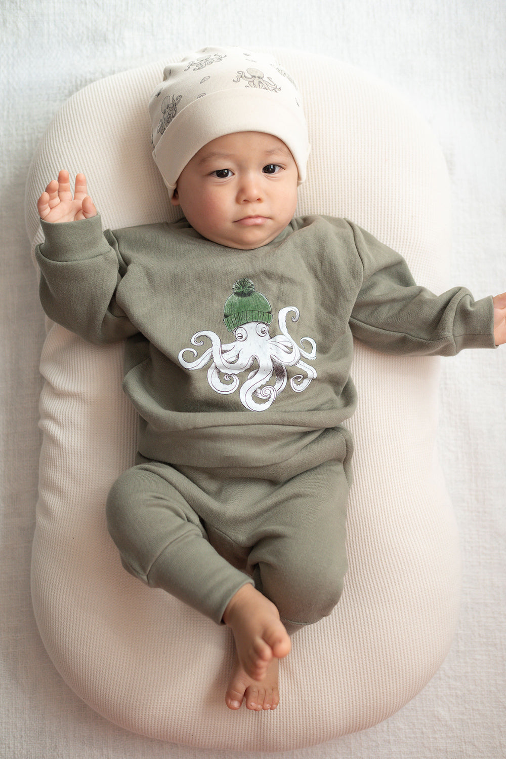 Child wearing Reversible Organic Beanie in Octopus.