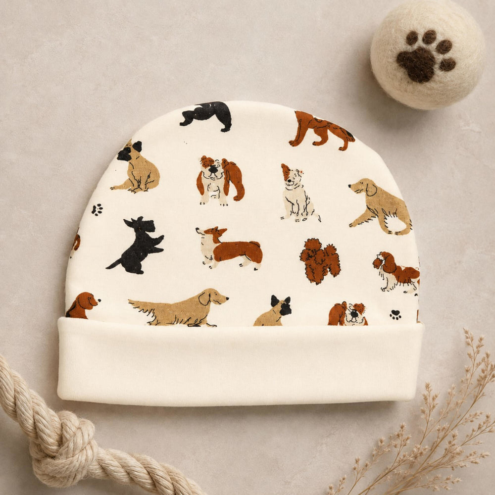 Child wearing Reversible Organic Beanie in Puppy Love.