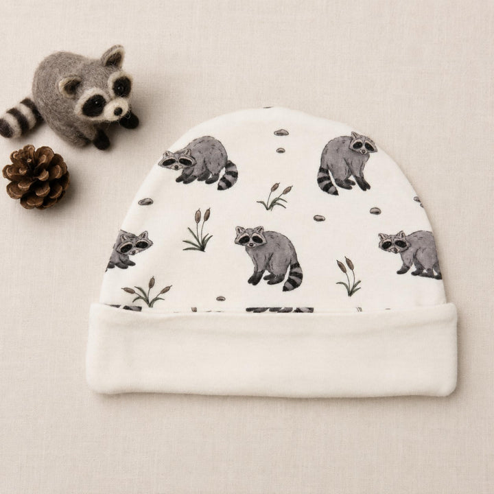 Child wearing Reversible Organic Beanie in Raccoon.