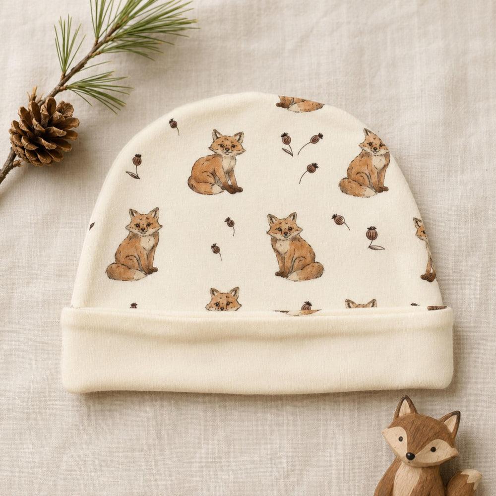 Child wearing Reversible Organic Beanie in Red Fox.