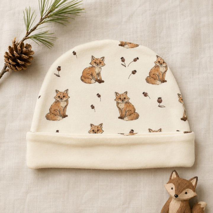 Child wearing Reversible Organic Beanie in Red Fox.