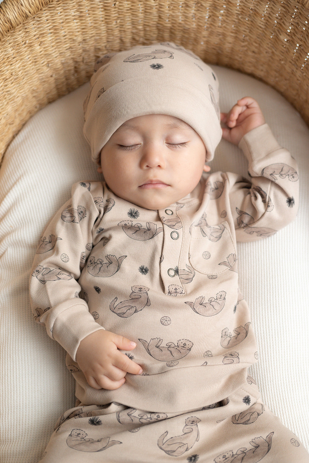 Child wearing Reversible Organic Beanie in Sea Otter.