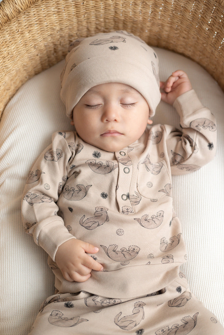 Child wearing Reversible Organic Beanie in Sea Otter.